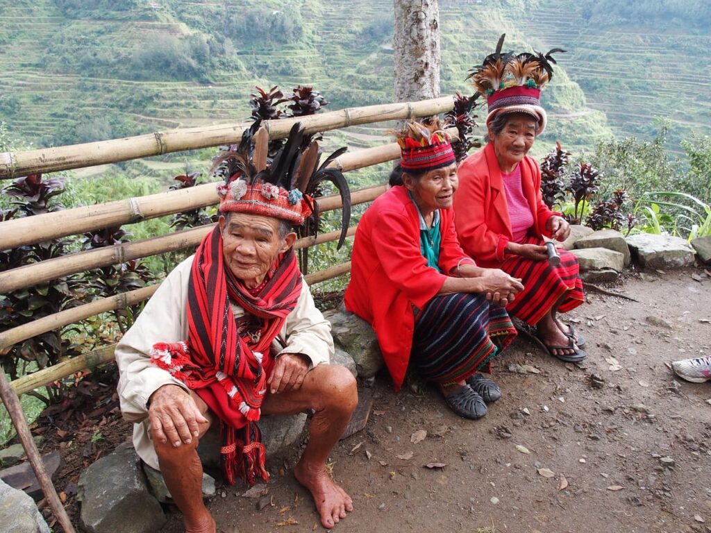 A group of smiling Filipino people gathered together, showcasing their vibrant culture and warm hospitality.