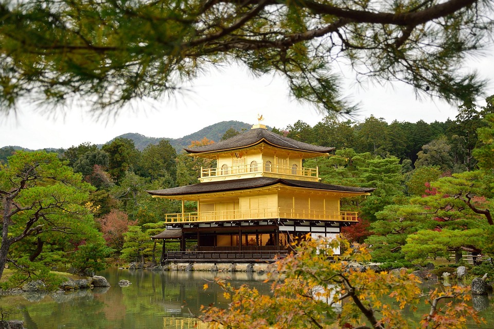 kinkaku-ji-kyoto-japan Kinkaku-ji Temple in Kyoto, Japan, the Golden Pavilion surrounded by a serene pond and lush gardens.