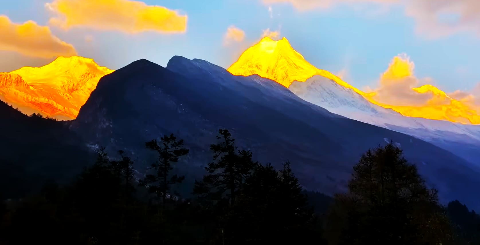 Golden sunrise over the snow-capped Manaslu mountain range, Himalayas, Nepal