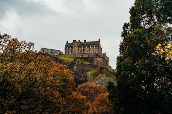 Edinburgh Castle perched on Castle Rock overlooking the historic city of Edinburgh, Scotland